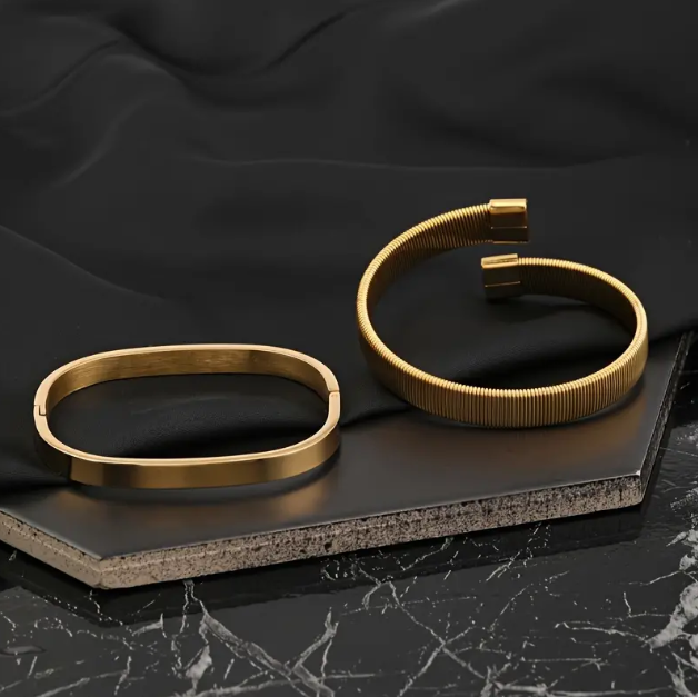 Discover the sophistication of Mozzimo Jewelry's men's 2 piece gold-plated flat bracelet set, an elegant accessory for every occasion.