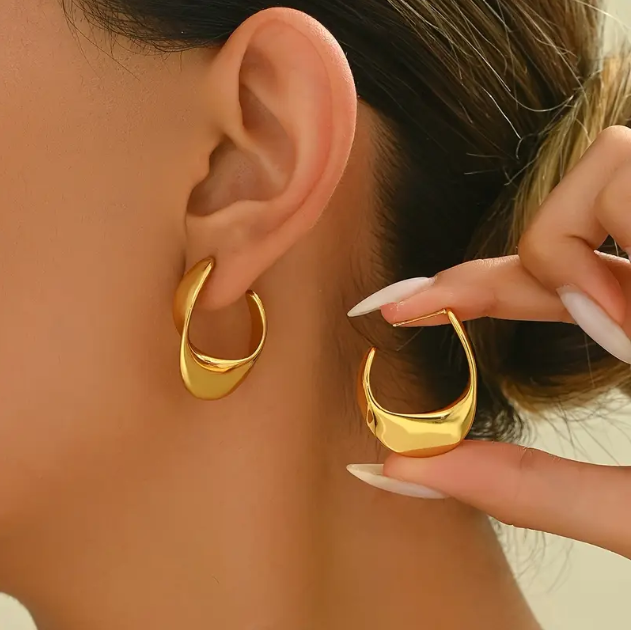 Make a bold statement with these Gold Plated Shiny Irregular Hoop Earrings—a sleek and modern twist on classic hoops with a high-polish finish.
