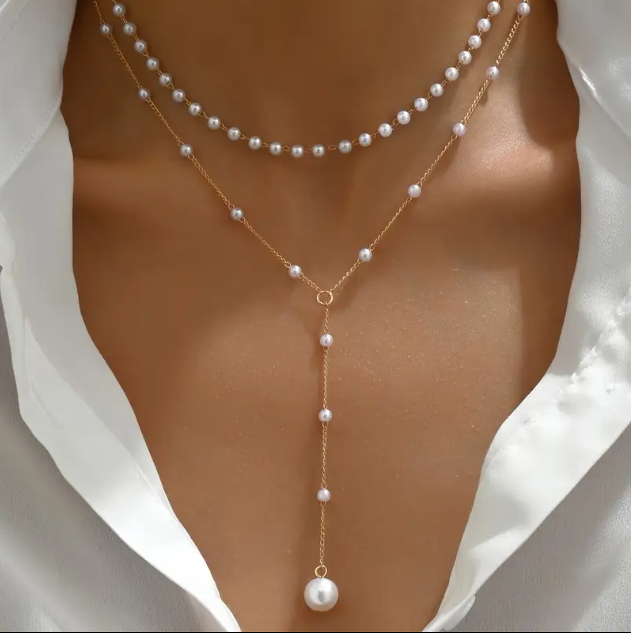 Elevate your style with Mozzimo Jewelry's 2 Piece Long Layered Mini Faux Pearls Gold Plated Necklace Set – timeless elegance meets modern layering trends.