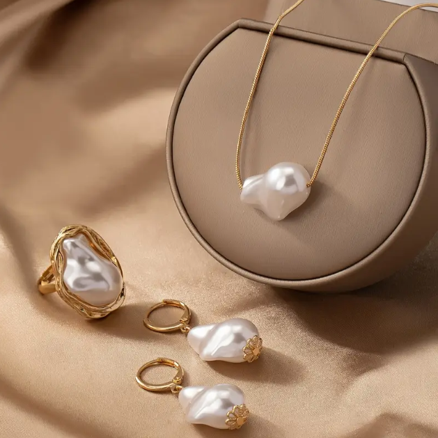 Elevate your elegance with this gold-plated 4-piece baroque pearl jewelry set featuring a minimalist necklace, statement ring, and matching earrings.