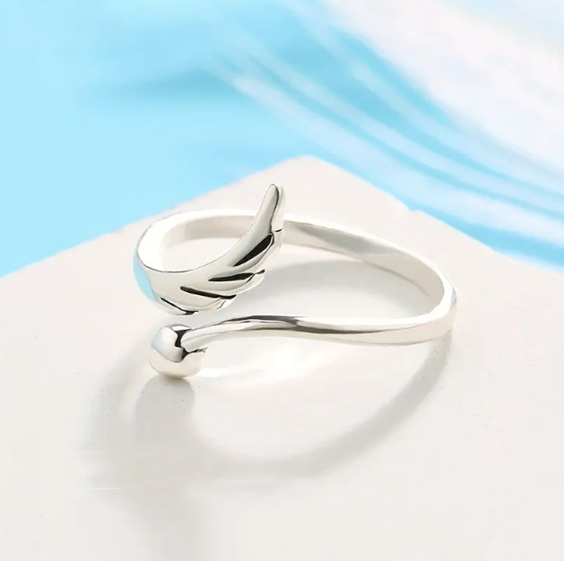 Shop the Sterling Silver Angel Wings Mini Heart Adjustable Ring at Mozzimo Jewelry β a dainty, celestial-inspired piece perfect for everyday elegance.