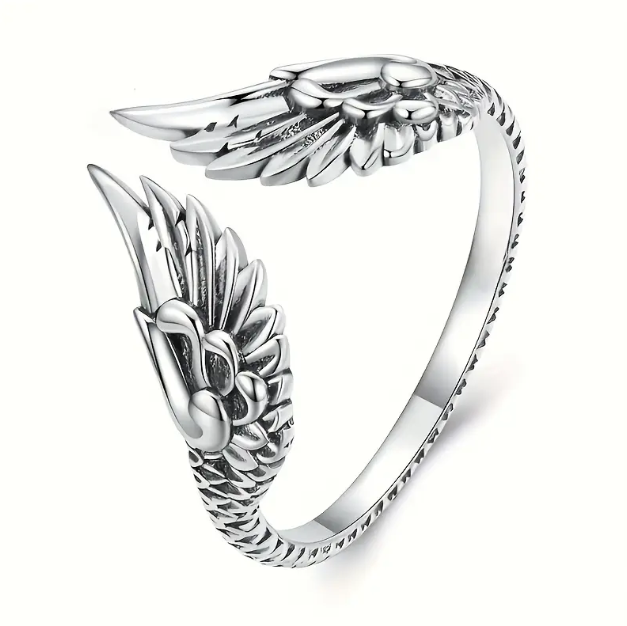 Embrace celestial elegance with this Sterling Silver Engraved Angel Wings Adjustable Ring, featuring intricate feather detailing and a timeless design.