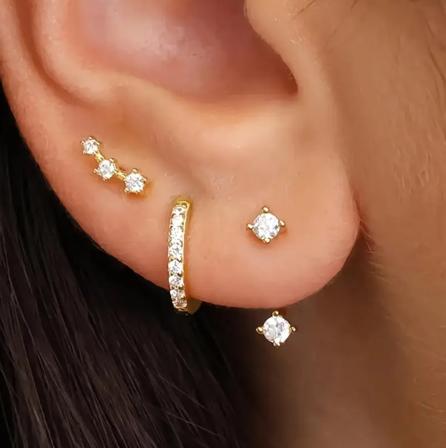 Shine bright with Mozzimo Jewelry's 3 Piece Golden Cubic Zirconia Mini Hoops and Studs Set – versatile, elegant, and perfect for effortless everyday style.