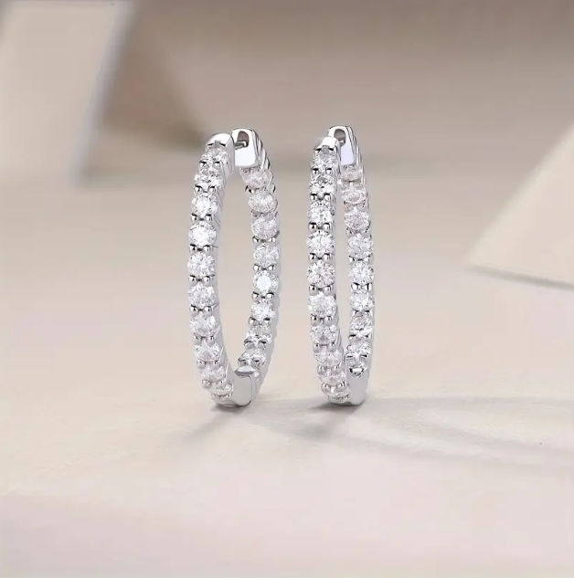 Elevate your style with the Sterling Silver Cubic Zirconia Rhinestone Encrusted Miniature Hoop Earrings—a dazzling, everyday essential. Shop now at Mozzimo Jewelry!