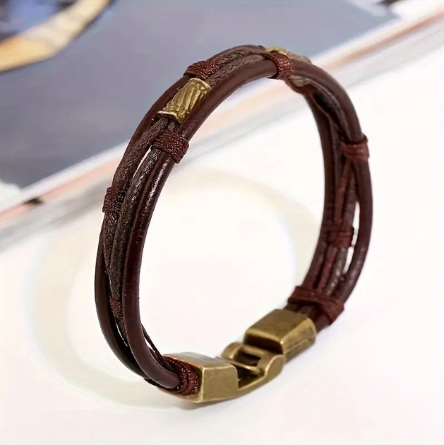 Upgrade your style with this men's brown multi-layer twine rope bracelet featuring a rusted gold-plated metal clasp—a bold, rugged accessory for modern men. Shop now at Mozzimo Jewelry!
