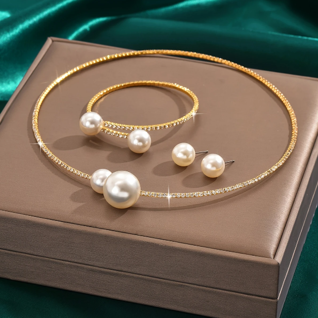 Drape yourself in timeless elegance with Mozzimo Jewelry’s 4 piece pearl and rhinestone choker set—sleek, sophisticated, and irresistibly chic.