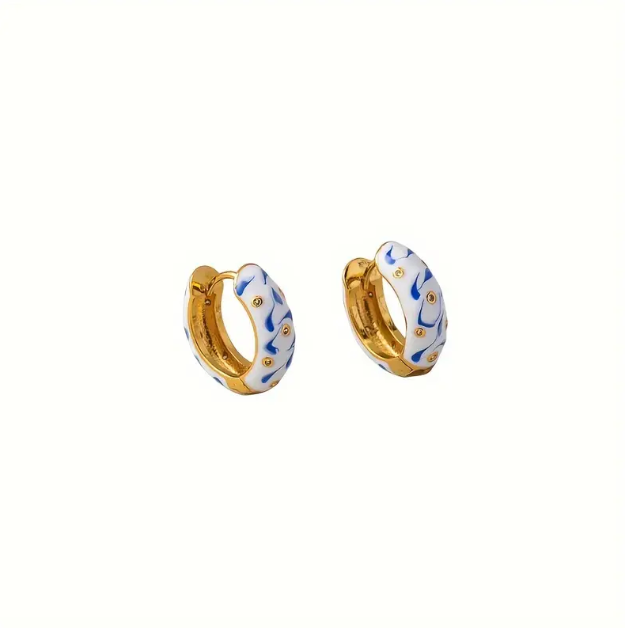 Chic and stylish, these gold-plated blue and white porcelain mini hoop earrings bring vintage elegance and everyday charm.