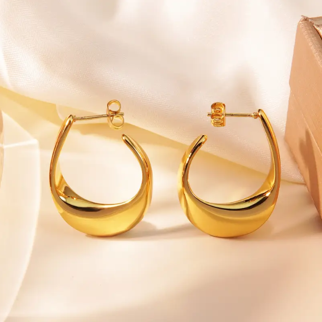 Make a bold statement with these Gold Plated Shiny Irregular Hoop Earrings—a sleek and modern twist on classic hoops with a high-polish finish.