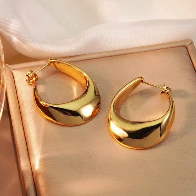 Make a bold statement with these Gold Plated Shiny Irregular Hoop Earrings—a sleek and modern twist on classic hoops with a high-polish finish.
