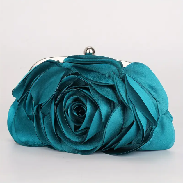 Add elegance to any outfit with the Gorgeous Turquoise Flower Silver Chain Clutch Purse, available now at Mozzimo Jewelry.