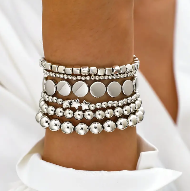 Elevate your stack game with this 6-piece sterling silver beaded bracelet set featuring stars, circles, and squares.