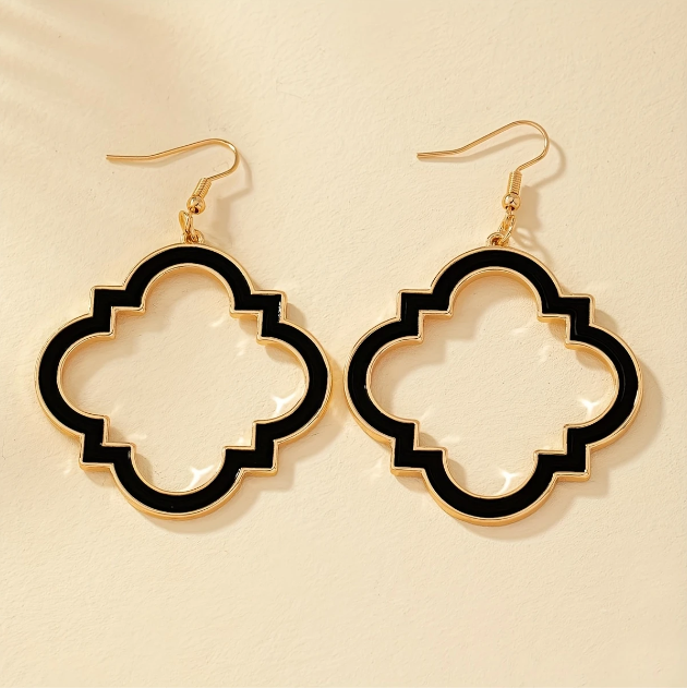 Make a bold statement with Mozzimo Jewelryβs gold plated geometric black enamel dangle earrings β elegant, edgy, and unforgettable.
