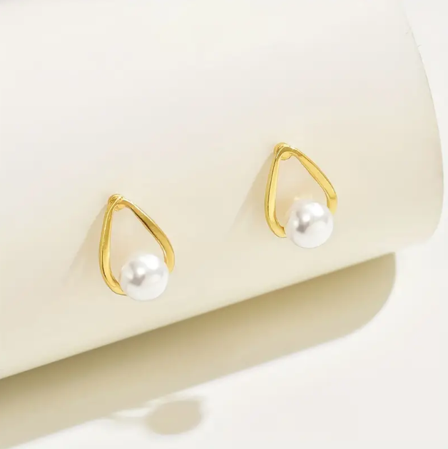 Add timeless elegance to your style with Gold Plated Teardrop Faux Pearl Earring Studs from Mozzimo Jewelry—shop classic pearl earrings today.
