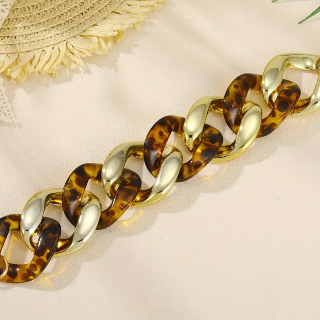 Make a bold statement with our Gold Plated Thick Tortoise Brown Weaved Chain Links Bracelet, a must-have trending piece.