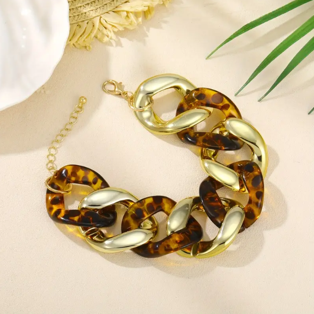 Make a bold statement with our Gold Plated Thick Tortoise Brown Weaved Chain Links Bracelet, a must-have trending piece.