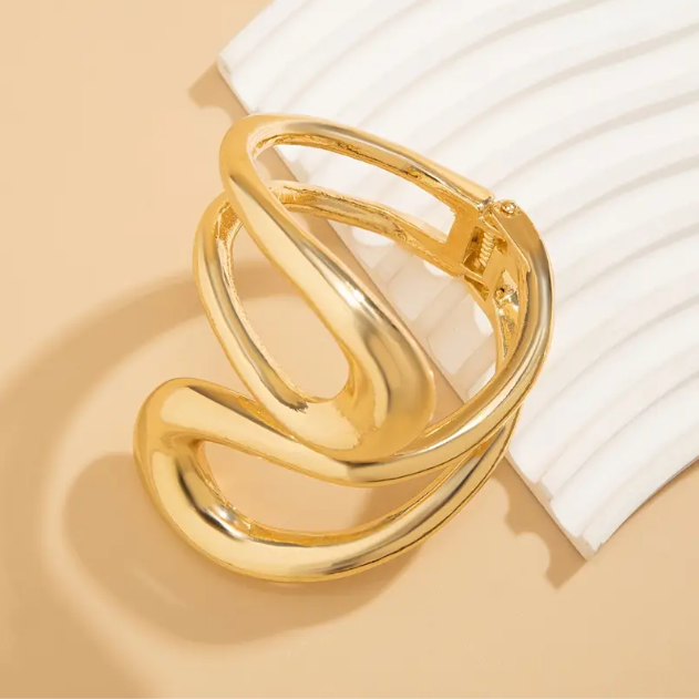 Shop stunning, gold and silver sculptural statement necklace and bracelet sets at Mozzimo Jewelry—perfect for standout style and unique gifts.
