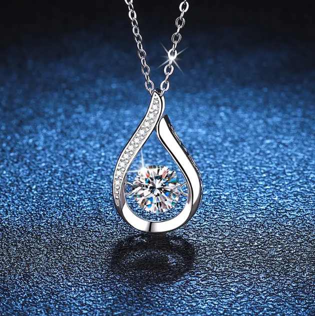 Add elegance to your look with the Sterling Silver Sparkly Teardrop Gemstone Pendant Necklace from Mozzimo Jewelry, offering timeless beauty and sparkle.