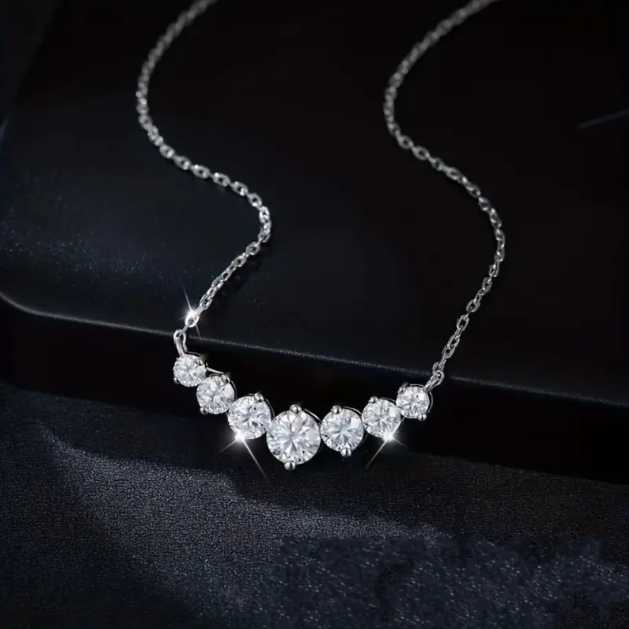 Enhance your style with the Sterling Silver Cubic Zirconia Interlocking Gemstones Fine Chain Necklace from Mozzimo Jewelry, offering elegance and luxury.