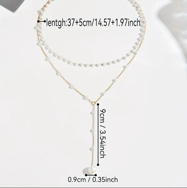 Elevate your style with Mozzimo Jewelry's 2 Piece Long Layered Mini Faux Pearls Gold Plated Necklace Set – timeless elegance meets modern layering trends.