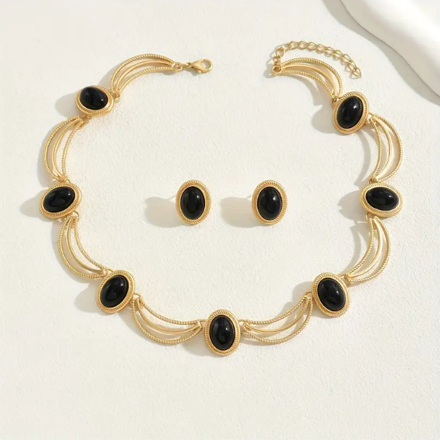 Elevate your look with this luxurious 3-piece gold-plated choker and black enamel earrings set from Mozzimo Jewelry, crafted for sophisticated elegance.