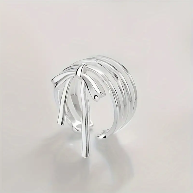Delicate and elegant, our Sterling Silver Wrapped Ribbon Bow Ring adds a feminine touch to any look with its adjustable fit.