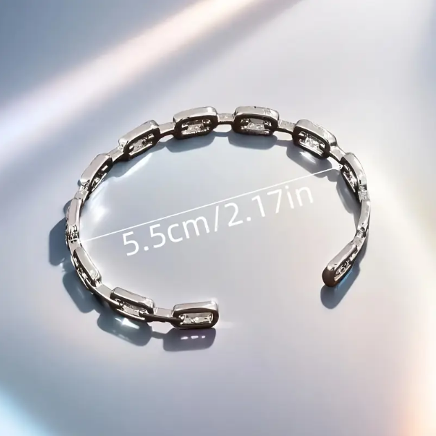 Add elegance to your style with the Glittery Sterling Silver Rhinestone Encrusted Interlocking Cuff Bracelet from Mozzimo Jewelry. Shop now for stunning luxury pieces.