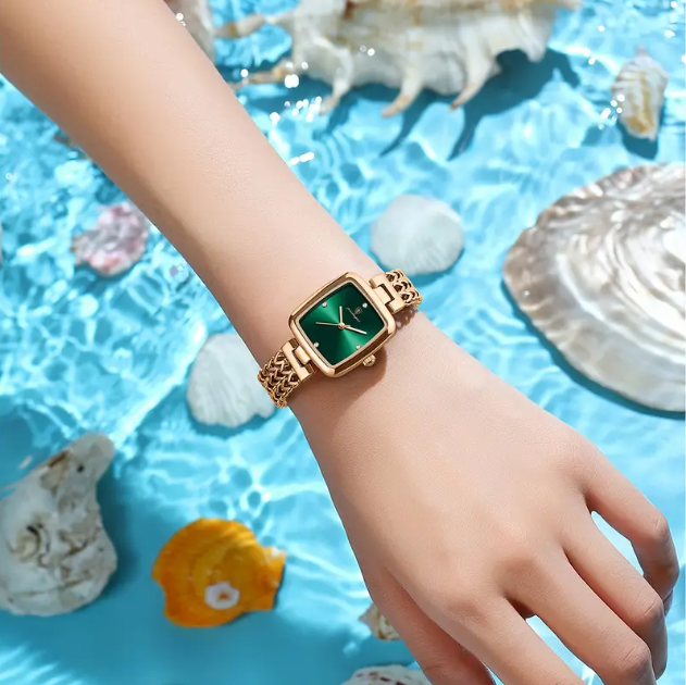 Timeless elegance meets modern sophistication with this Gold Plated Square Emerald Green Quartz Chevron Chain Watch.