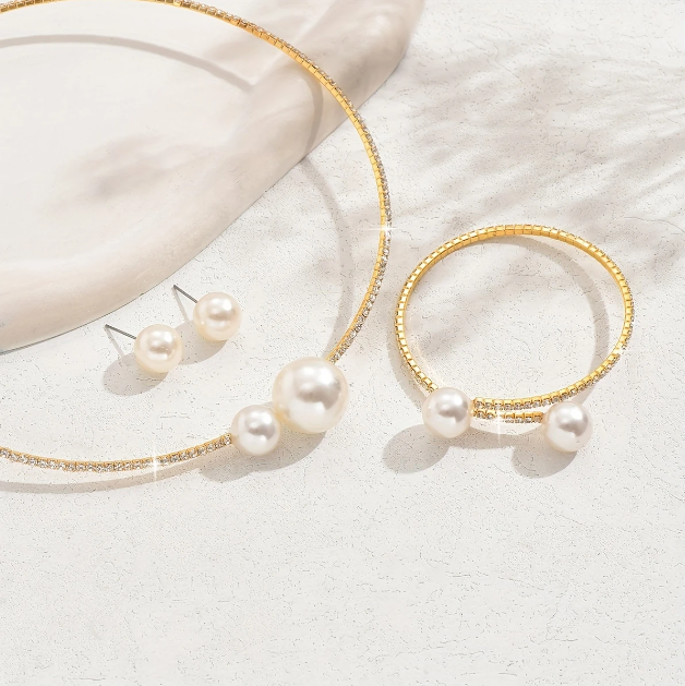 Drape yourself in timeless elegance with Mozzimo Jewelry’s 4 piece pearl and rhinestone choker set—sleek, sophisticated, and irresistibly chic.