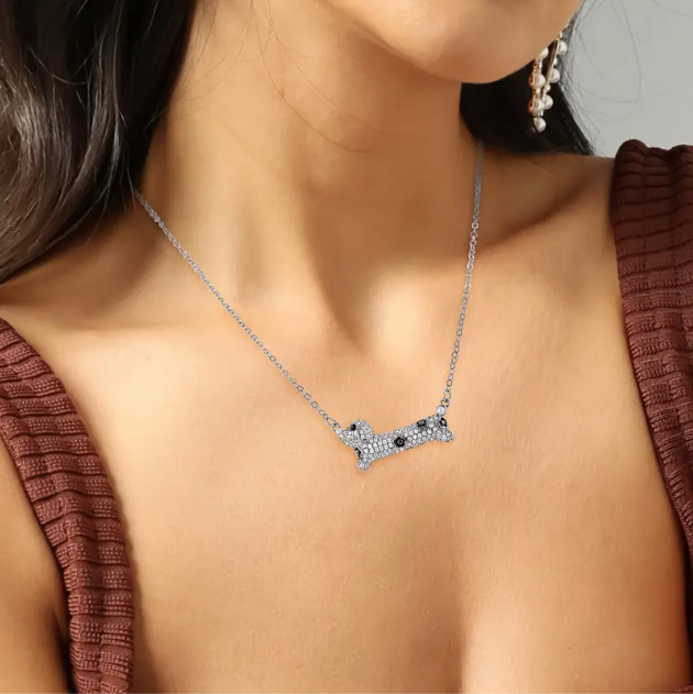Show your love for pets with the Sterling Silver Rhinestone Encrusted Spotted Dog Pendant Necklace, a playful and elegant accessory—available now at Mozzimo Jewelry.