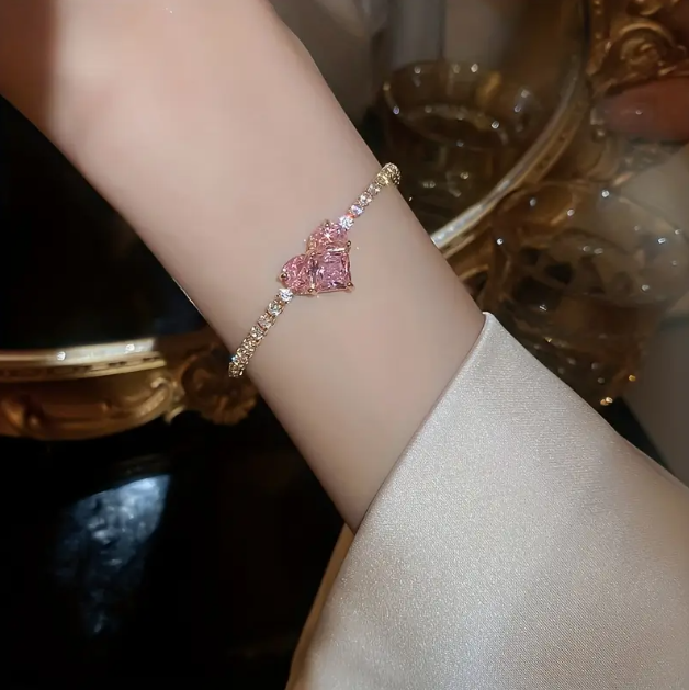 Elevate your style with our Gold Plated Rhinestone Encrusted Large Heart Gemstone Adjustable Bracelet, a luxurious statement piece.