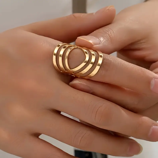 Make a bold statement with the Gold Plated Geometric Cutout Adjustable Ring – a modern and eye-catching accessory crafted with titanium steel for a stylish.