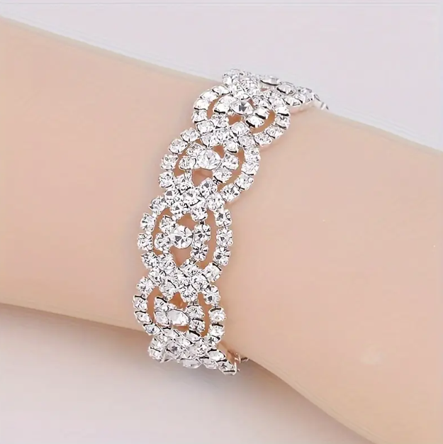 Shop the stunning silver rhinestone-studded clasp weave bracelet, a perfect blend of elegance and versatility, at Mozzimo Jewelry today.
