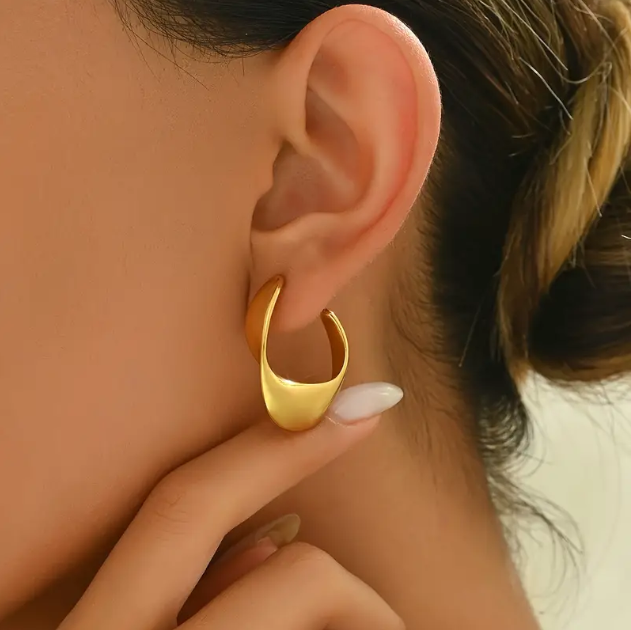 Make a bold statement with these Gold Plated Shiny Irregular Hoop Earrings—a sleek and modern twist on classic hoops with a high-polish finish.