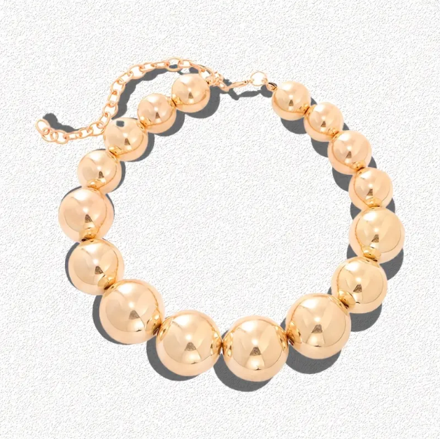 Make a bold fashion statement with this Gold Plated Large Pearl Beads Statement Choker Necklace, a glamorous and trendy must-have for every jewelry lover.