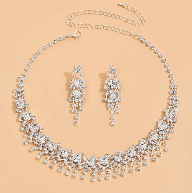 Elevate your style with the 3 Piece Sterling Silver Rhinestone Encrusted Choker Necklace and Dangle Earrings Set from Mozzimo Jewelry. Shop now at www.mozzimojewelry.com.