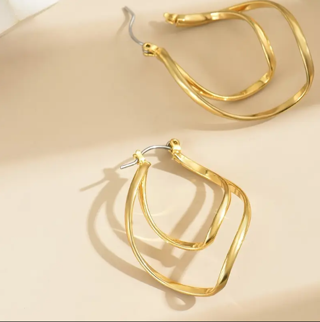 Add a touch of floral elegance with these Gold Plated Double Layered Petal Drop Earrings, featuring a radiant gold-plated finish and delicate layered petal design.