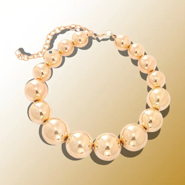 Make a bold fashion statement with this Gold Plated Large Pearl Beads Statement Choker Necklace, a glamorous and trendy must-have for every jewelry lover.