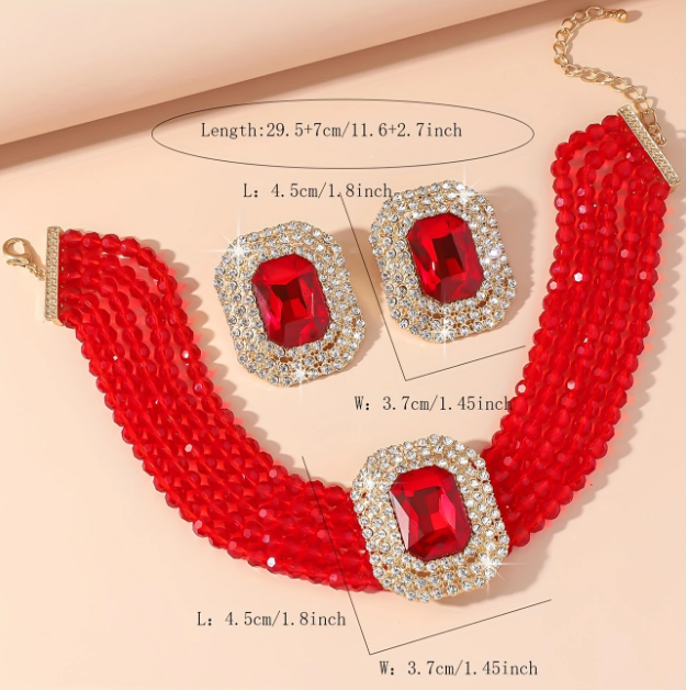 Turn heads with this dazzling 3-piece red jeweled statement choker and stud earrings set—perfect for bold, confident looks at www.mozzimojewelry.com.