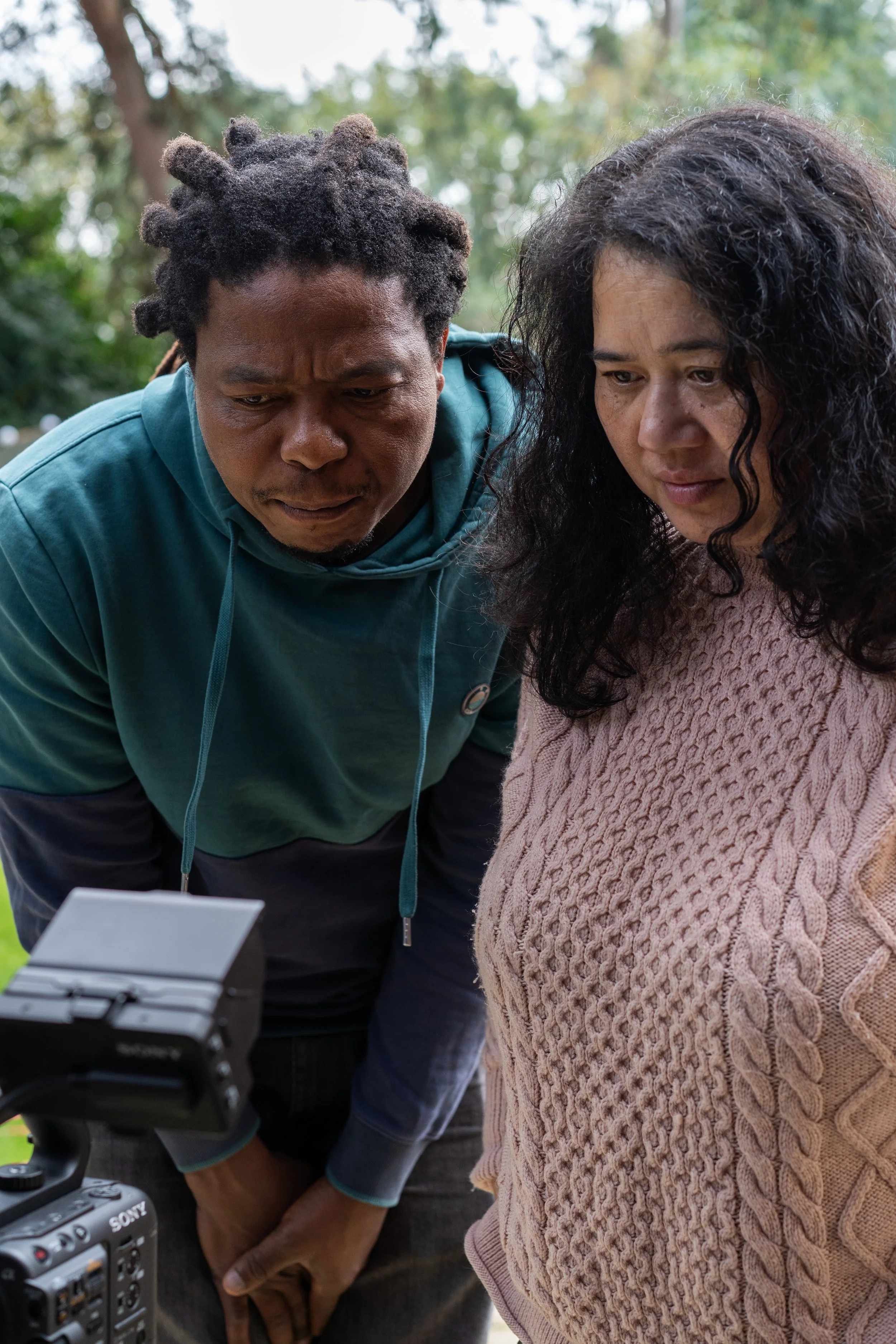 Director and cinematographer reviewing playback during short film production
