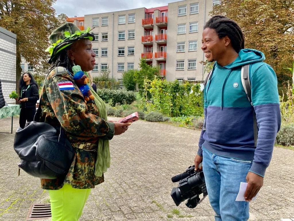 Cinematographer speaking with documentary participant after filming in Amsterdam Southeast