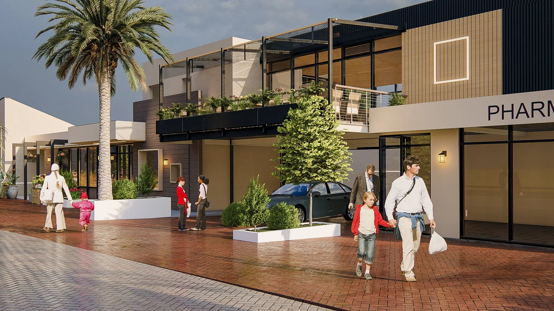 A modern commercial building street scene with people walking on a brick sidewalk, parked cars, trees, and plants, with a pharmacy sign visible.