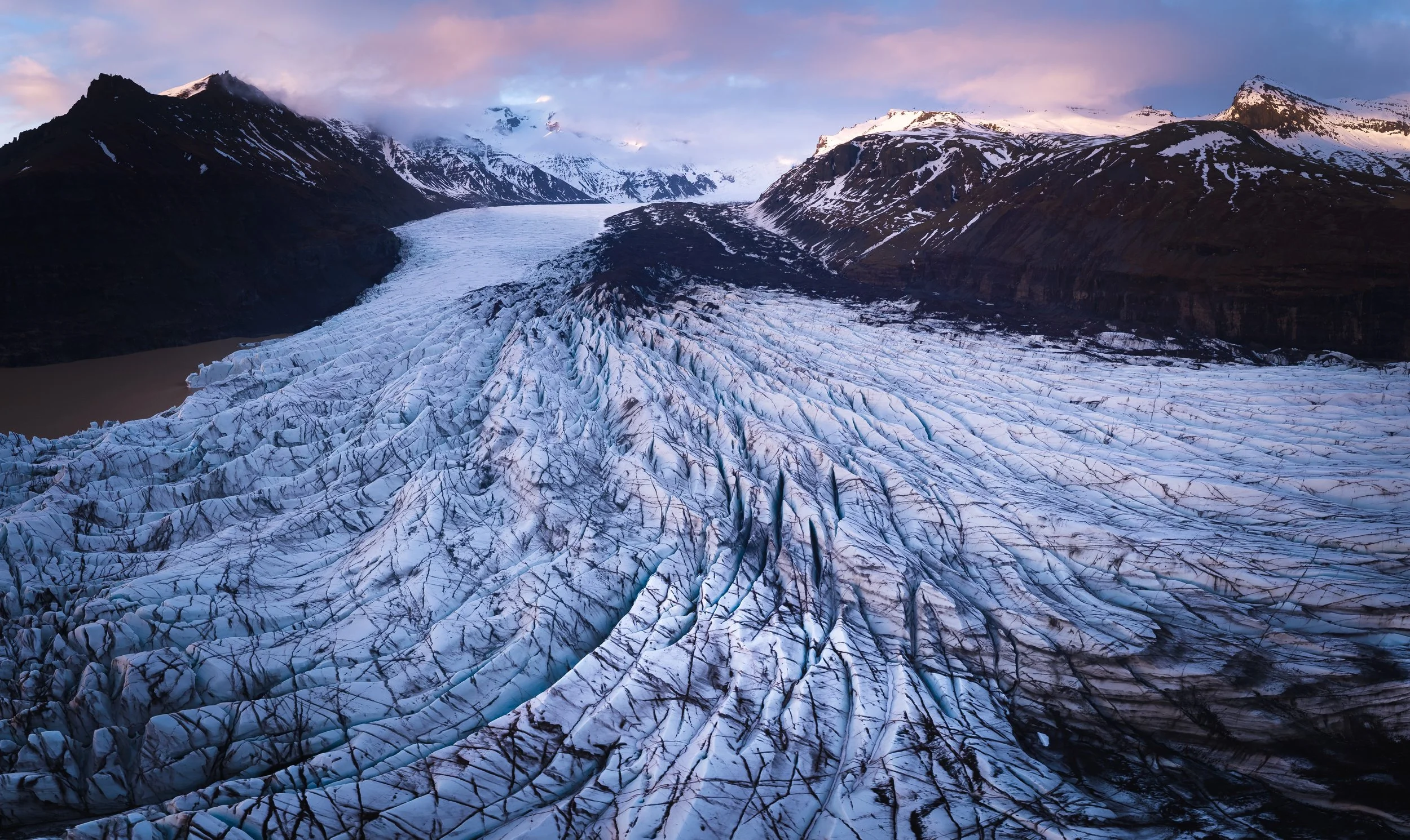 Evening light bathes the glacier at Skaftafell in vibrant colours