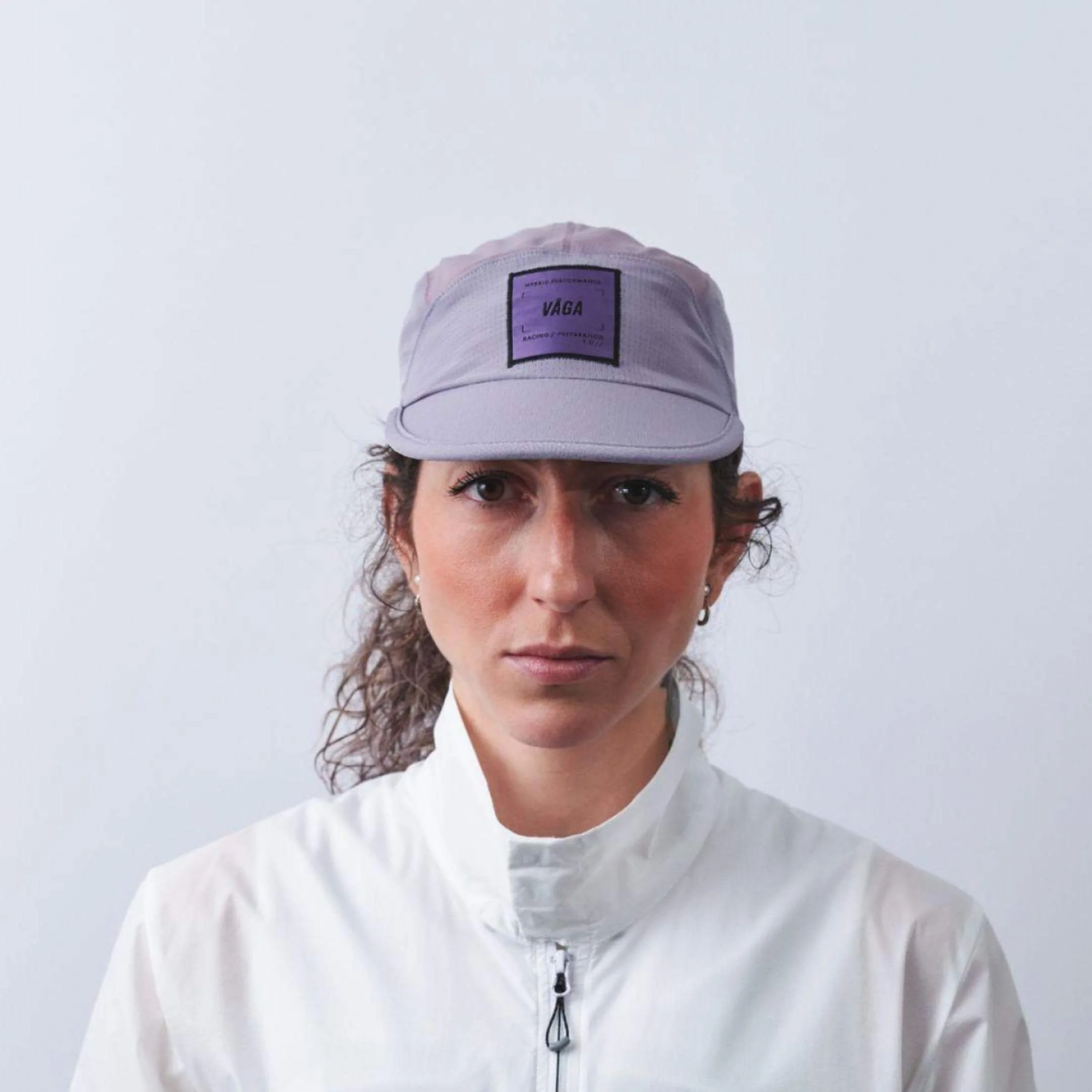 vaga-transit-lite-cap-unstructured-running-cap-mauve-model-front.jpg