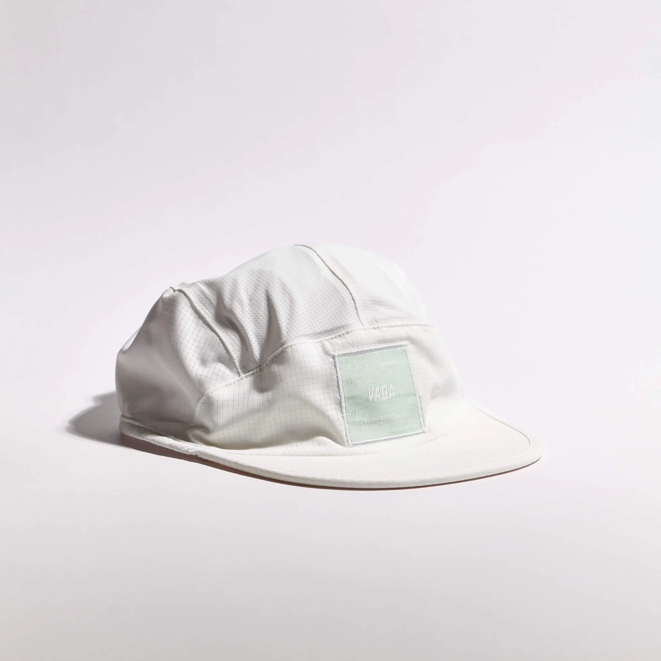 vaga-transit-lite-cap-unstructured-running-cap-white-angle.jpg