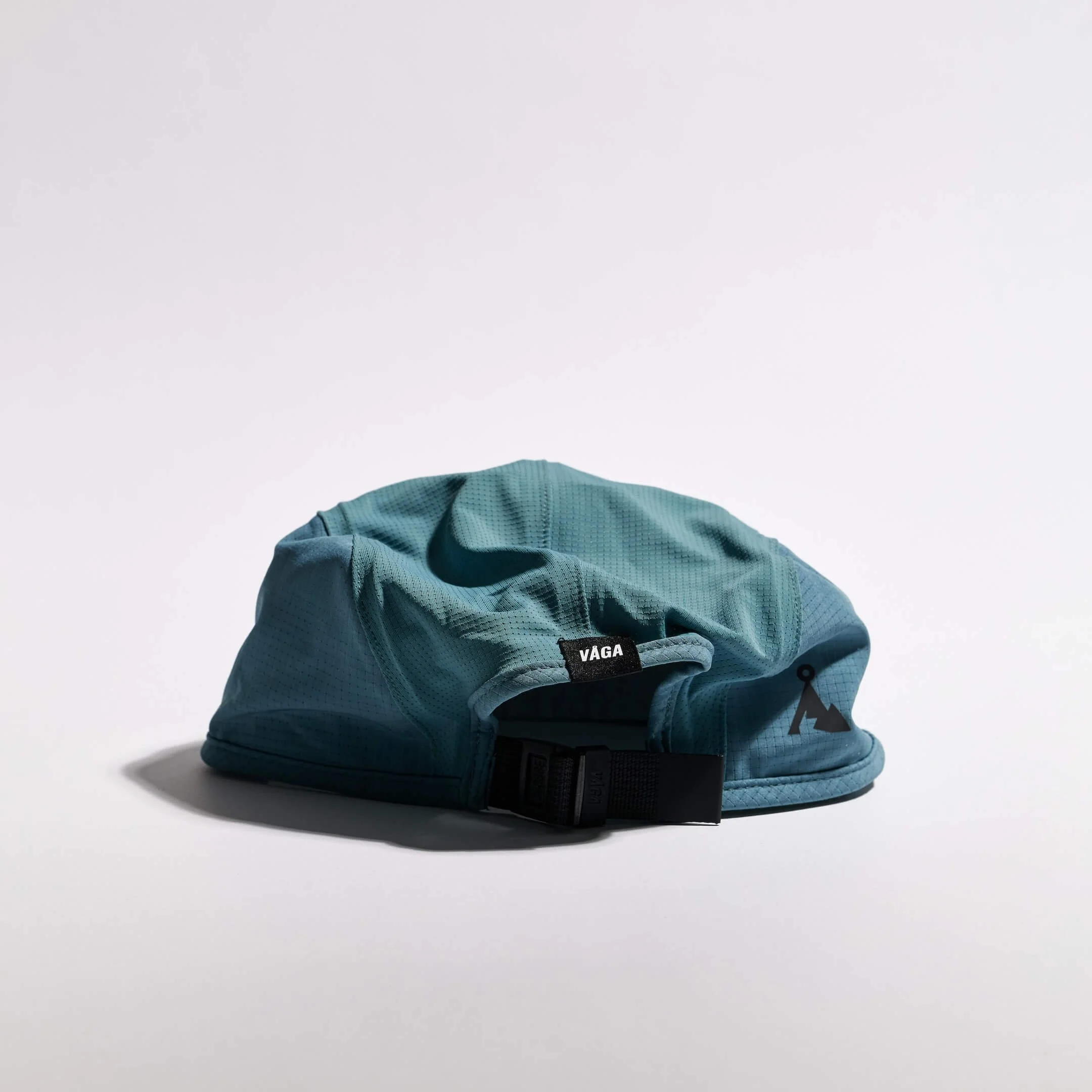 vaga-transit-lite-cap-unstructured-running-cap-teal-back.jpg