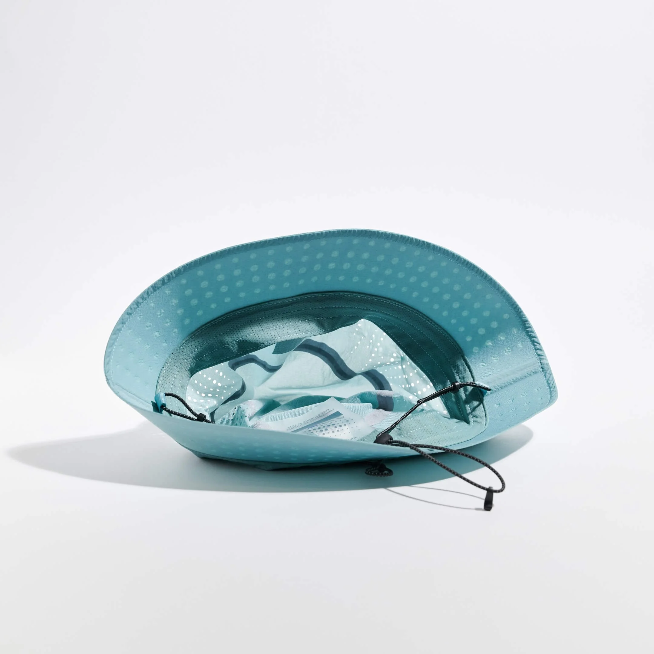 VAGA ALTOS Running Bucket Hat in Teal Underneath.jpg