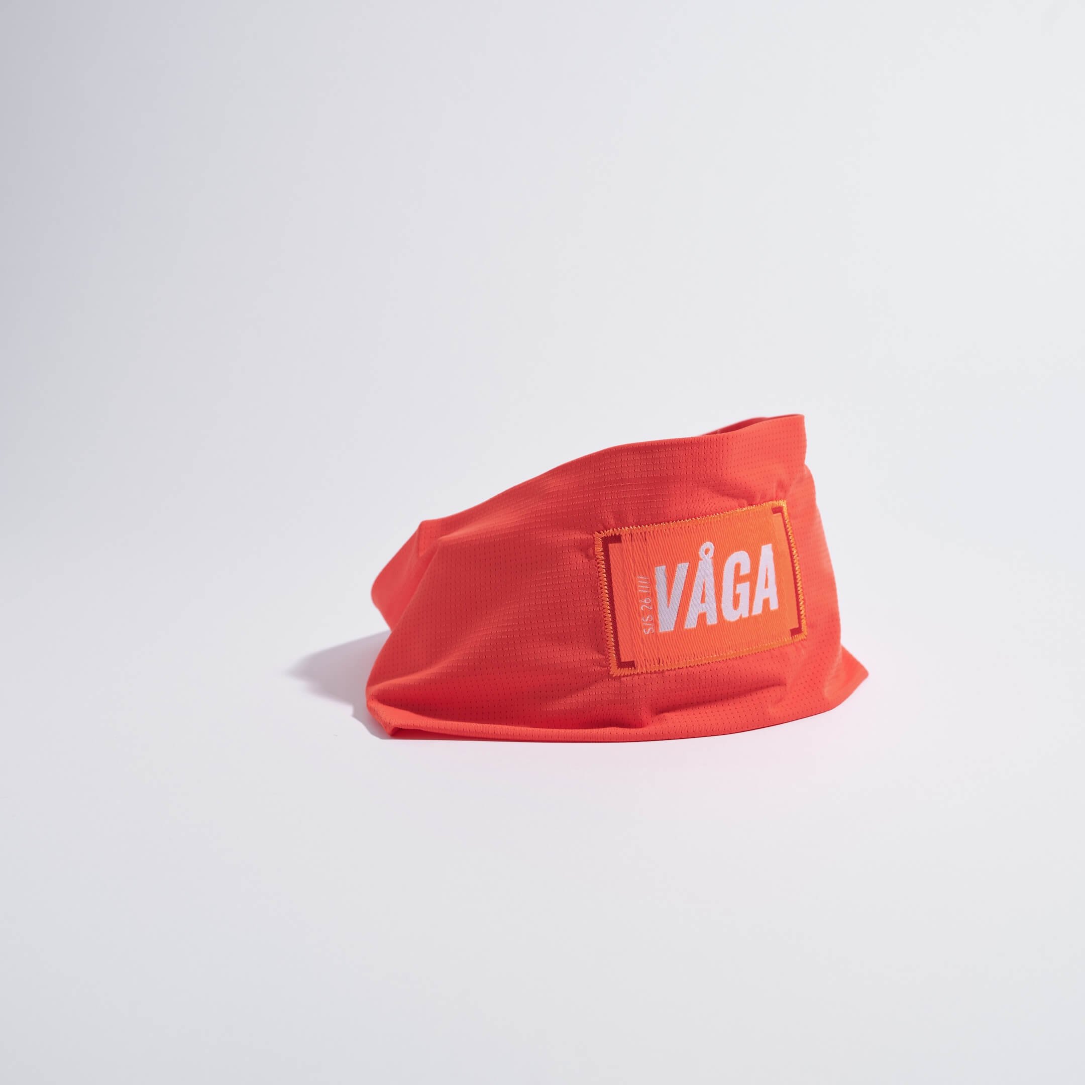 vaga-lightweight-mesh-running-headband-neonpeach-stood.jpg