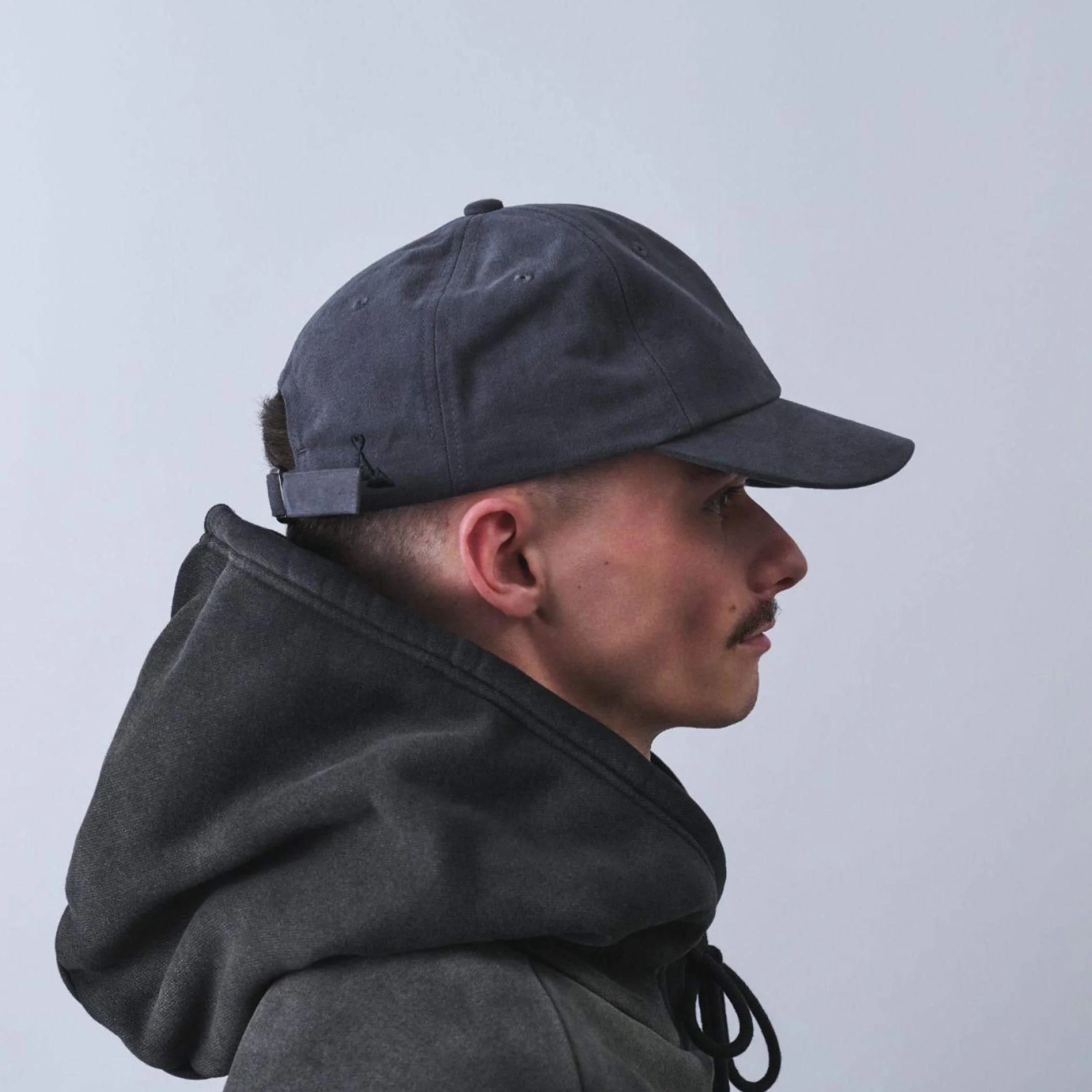 vaga-washed-cotton-cap-charcoal-model-profile.jpg