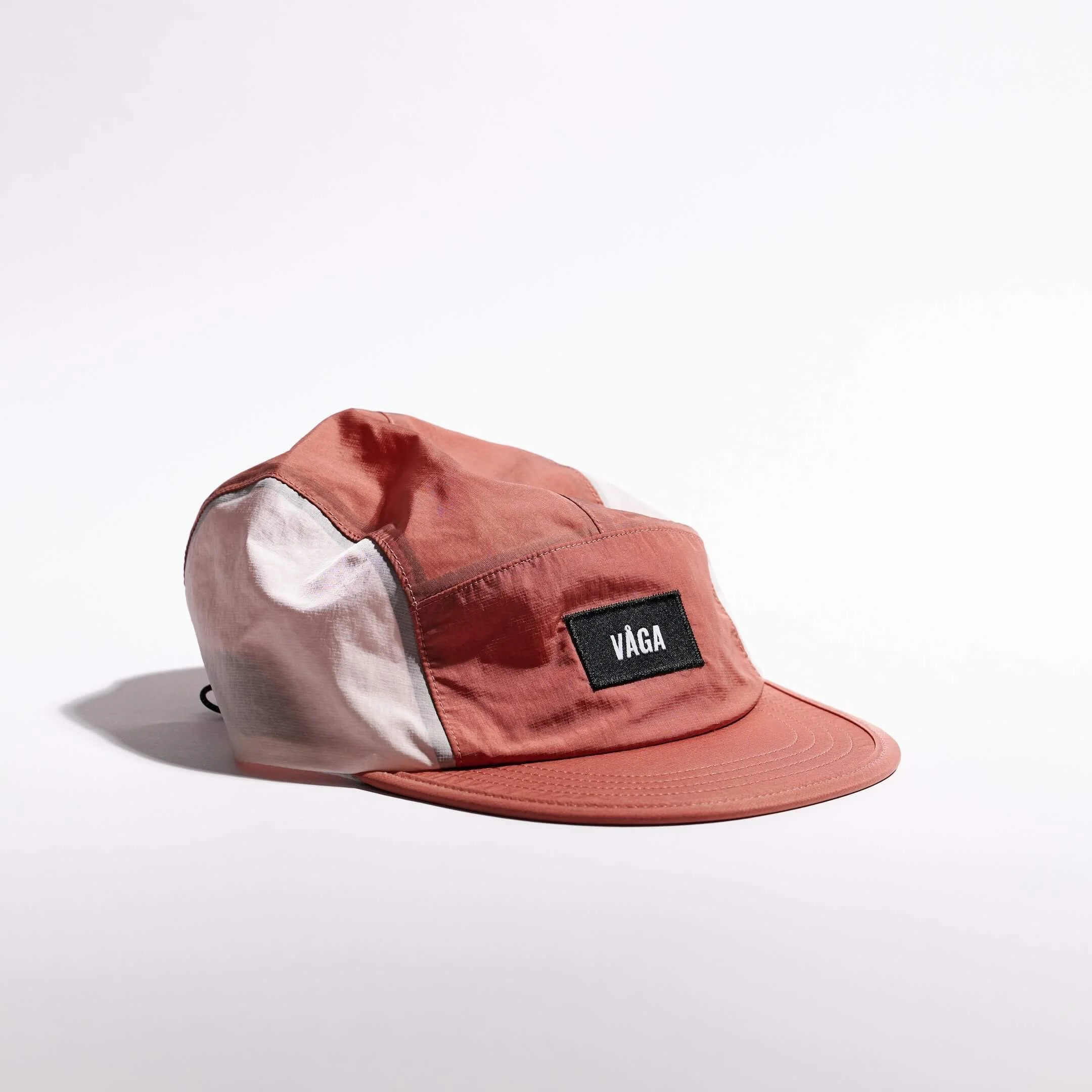 vaga-pacer-cap-running-cap-clayred-palepink-angle.jpg