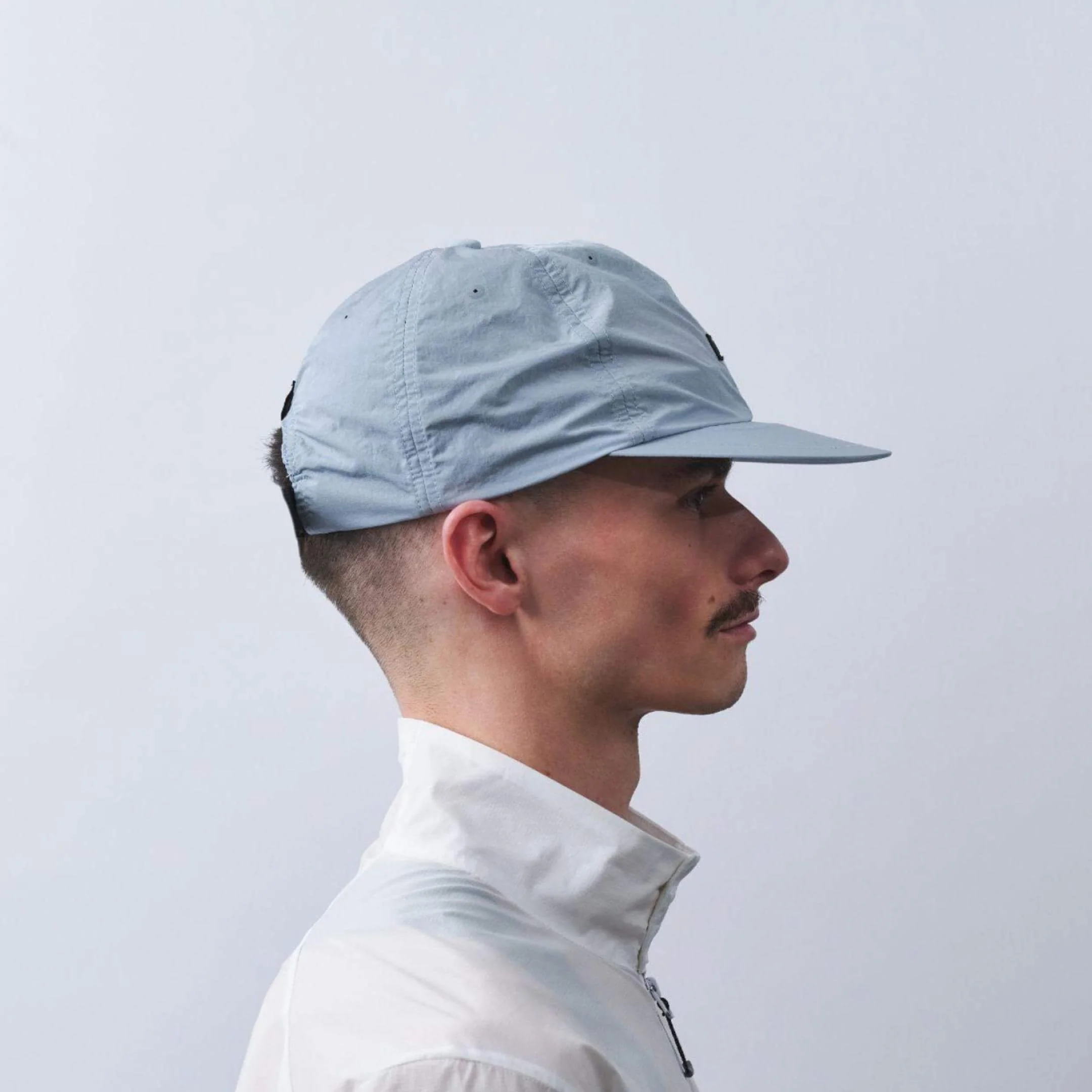 vaga-drift-cap-running-cap-postalblue-model-side-profile.jpg